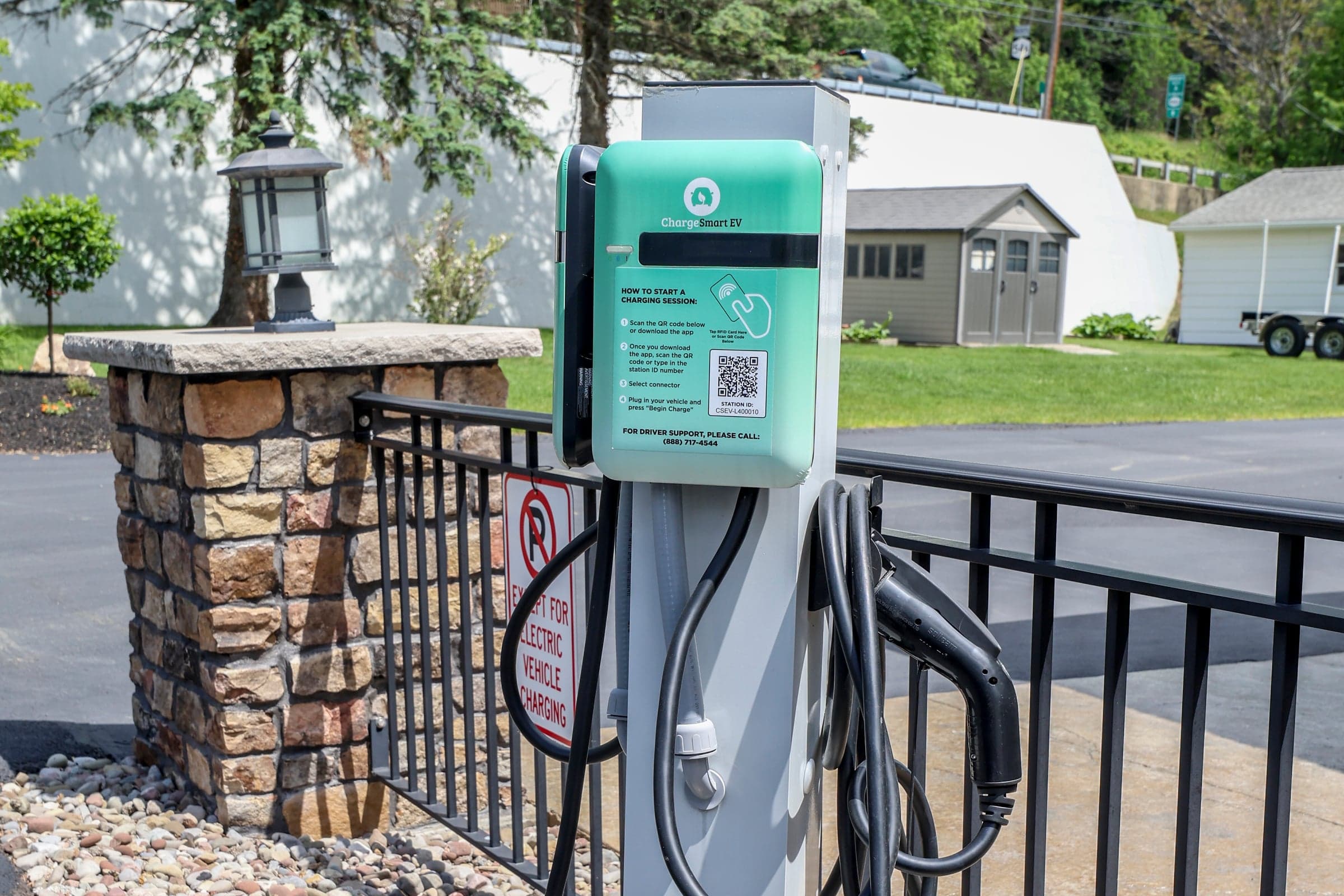 The inn's electric vehicle charging station, with its cable coiled below the unit